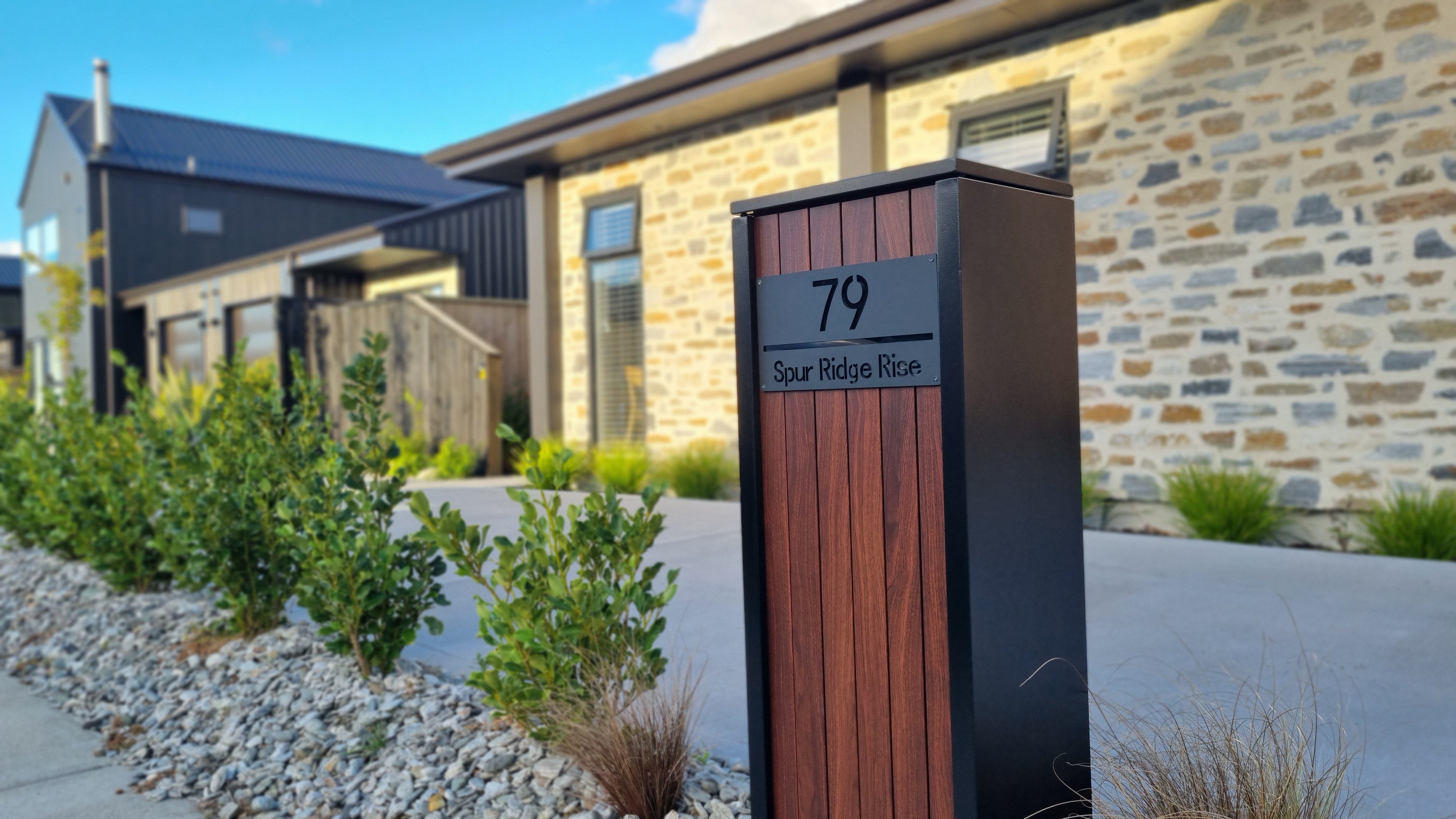 Beachlands Pillar w Kwila woodgrain like panels by Aspect Box